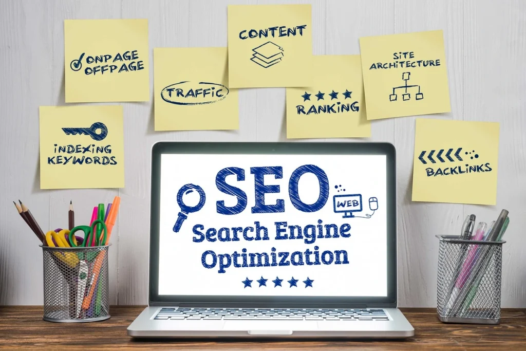 laptop with post notes about seo